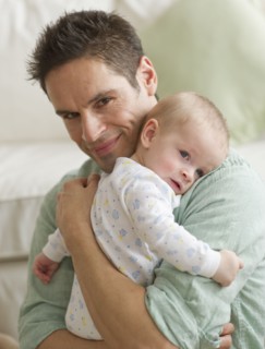 Father hugging baby.