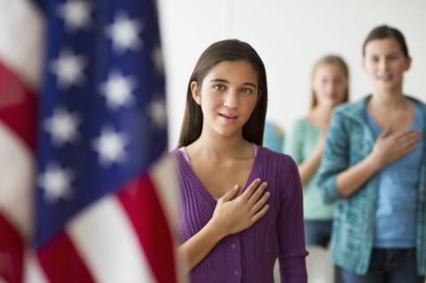 Students saying pledge of allegiance.