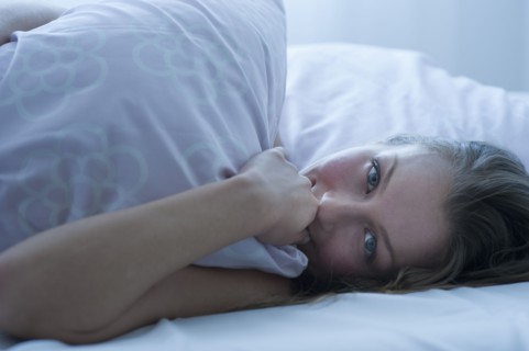 Woman in bed.