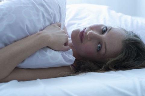 Woman in bed.