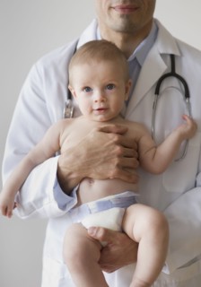 Doctor holding baby.