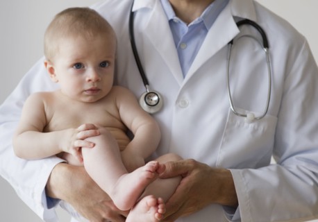 Doctor holding baby.