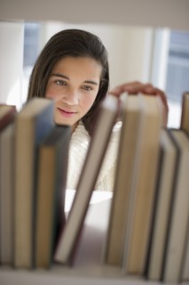 Student selecting book.