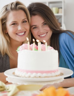 Friends and birthday cake. Photographer: Jamie Grill