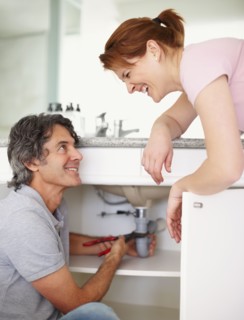 Fixing a leaky sink. Photographer: momentimages