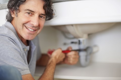 Fixing a leaky sink. Photographer: momentimages