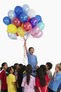 Children and balloons. Photographer: momentimages