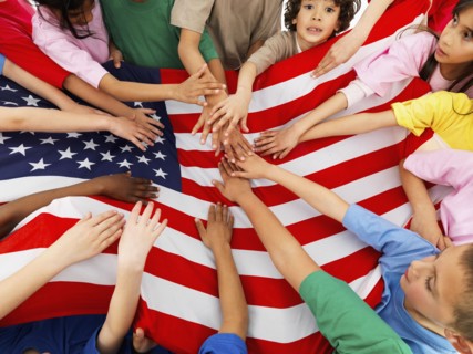 Children holding flag. Photographer: momentimages