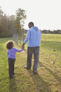Father and daughter walking. Photographer: Pauline St.Denis