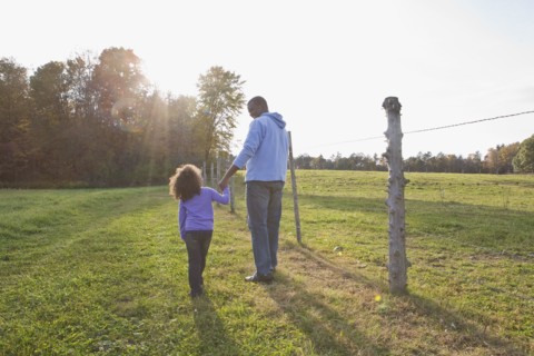 Father and daughter walking. Photographer: Pauline St.Denis