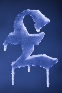 Frozen British pound symbol. Photographer: Mike Kemp