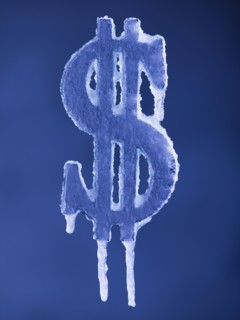 Frozen American dollar symbol. Photographer: Mike Kemp