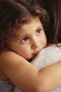 Mother comforting daughter. Photographer: Rob Lewine