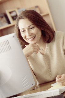 Woman working at computer. Photographer: Rob Lewine