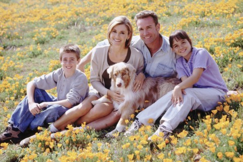 Portrait of a family in a meadow. Photographer: Rob Lewine