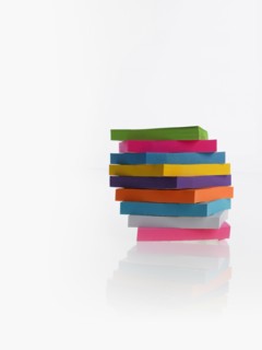 Stack of colorful post-it notes. Photographer: David Arky