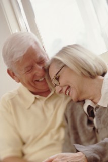 Elderly couple embracing. Photographer: Rob Lewine