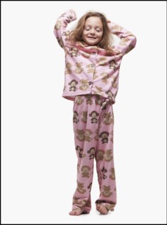 Young girl wearing pajamas. Photographer: Mike Kemp