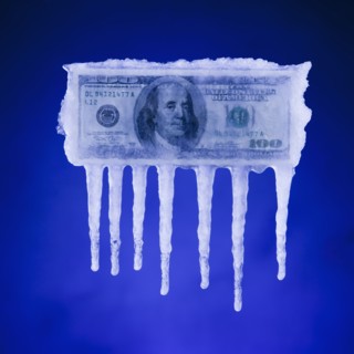 Money covered in ice. Photographer: Mike Kemp
