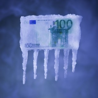 Money covered in ice. Photographer: Mike Kemp