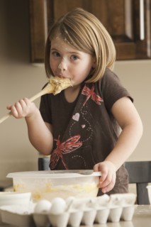 Tasting the batter. Photographer: Mike Kemp