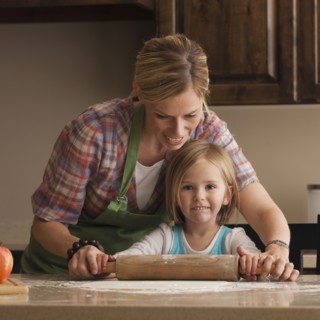 Mother and daughter baking. Photographer: Mike Kemp
