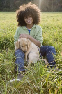 Child and dog. Photographer: Pauline St.Denis