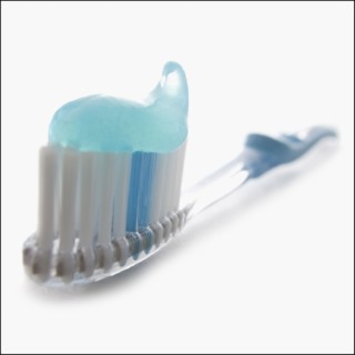 Toothbrush and toothpaste. Photographer: Mike Kemp