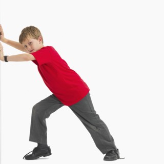 Boy pushing something. Photographer: momentimages