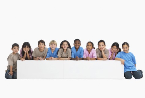 Children sitting in a row. Photographer: momentimages