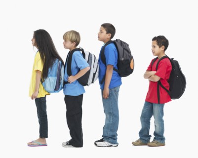 Line of children wearing backpacks. Photographer: momentimages