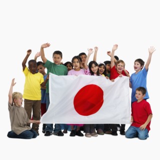 Children holding flag. Photographer: momentimages