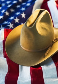 Cowboy hat on American flag.