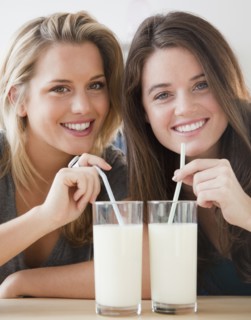 Friends drinking milk. Photographer: Jamie Grill