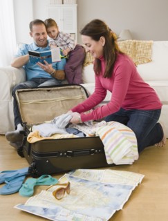 Packing for family vacation. Photographer: Jamie Grill
