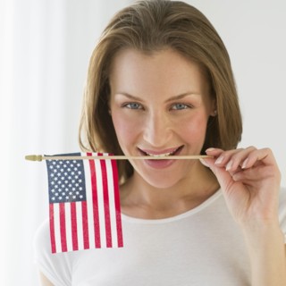 Woman holding American flag.