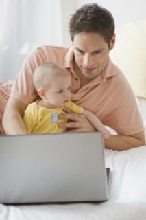 Father working on laptop.