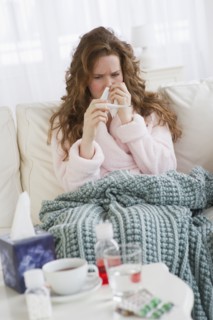 Sick woman on couch.