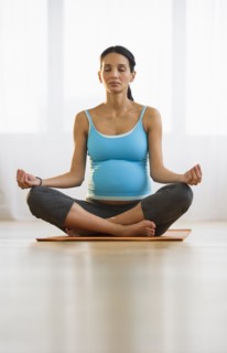 Pregnant woman meditating.