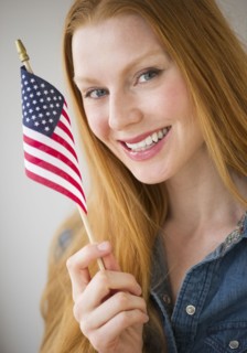 Woman holding American flag.