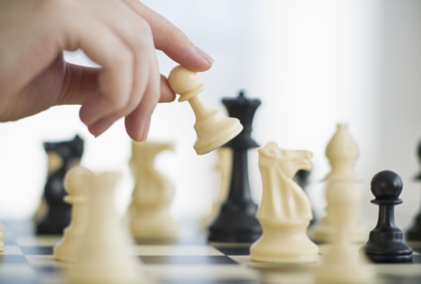 Playing game of chess.