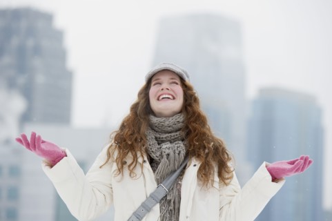 Woman enjoying a snowy day.