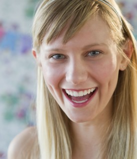 Young woman laughing.