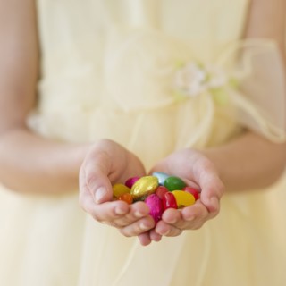 Hands holding Easter eggs.