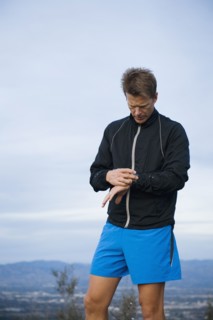 Runner checking watch.
