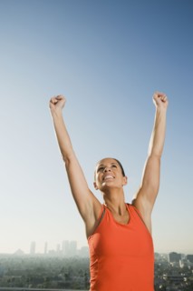 Woman raising her arms.