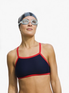 Woman wearing swimming goggles.