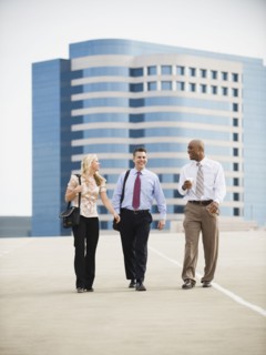 Co-workers walking in parking lot.
