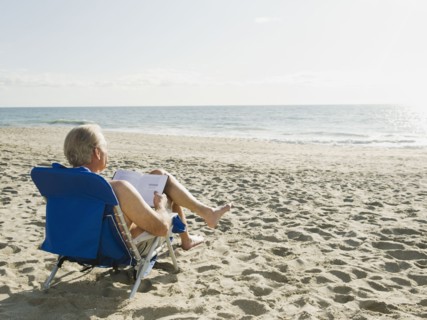 Man relaxing in beach chair.