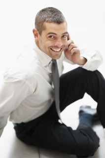 Businessman talking on phone. Photographe : momentimages